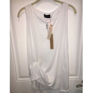 New white sleeveless blouse with cinched waist